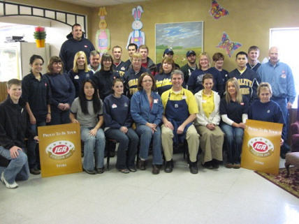 Quality Foods employees gather for a picture